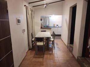 a dining room with a table and chairs and a kitchen at Las Toribias II in El Rincón +9 photos