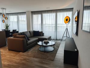 a living room with a couch and a table at Sun Tower in Zurich