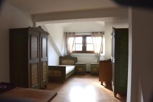 a bedroom with a bed and a window at Pension Aigner in Waldkirchen