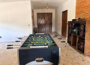 a room with a pool table with balls on it at La isla encantada in Aculco de Espinoza
