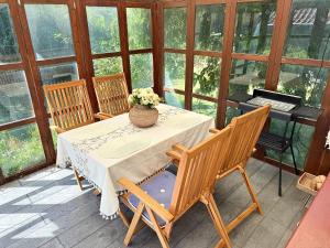 a table with a vase of flowers on a porch at Villa in central Visby in Visby