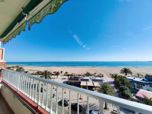 a view of the beach from the balcony of a condo at Vistal Mar in Puerto de Sagunto