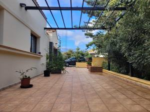 a walkway in a house with trees and plants at House with a heated pool for your exclusive use in Santa Brígida