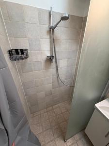 a shower stall in a bathroom with a shower at Balcony Apartment - Lyngby Great Copenhagen in Kongens Lyngby +57 photos