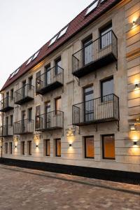 a building with balconies on the side of it at Or Haganuz in Dobrovelychkivka