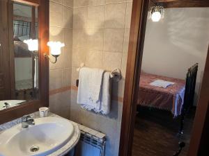 a bathroom with a sink and a mirror at Casa del Herrador I in Carrascal del Río +28 photos