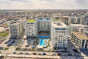 an aerial view of a building with a parking lot at Alezzi Infiniti Resort & SPA - SUNRISE 349 in Năvodari