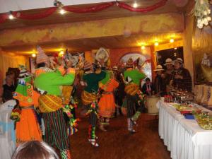 a group of people dancing in a room at Isabela Hotel Suite in La Paz