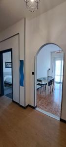 a room with a table and a room with a mirror at Via Roma 48 in Arquata Scrivia