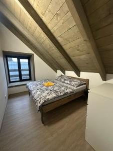 a bedroom with a bed in a attic at Apartmán Vališka in Horní Bečva