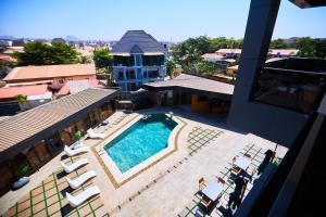 an overhead view of a swimming pool on a building at Bourdillon Hotel and apartments in Gwarinpa