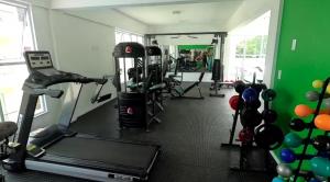 a gym with cardio equipment and balloons in it at Rogerio AP Compartilhado in Caucaia