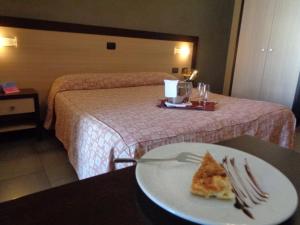 Postel nebo postele na pokoji v ubytování Hotel Airone