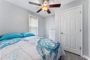 a bedroom with a bed and a ceiling fan at 404 W Maple Ave, Unit A in Wildwood