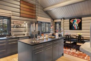 a kitchen with a large island and a dining room at TH590- Large ski-in out chalet with jacuzzi, sauna in Trysil in Trysil