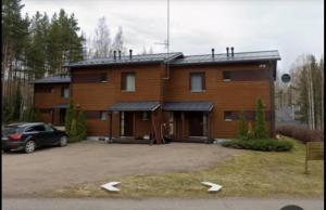 a house with a car parked in front of it at Коттедж in Lappeenranta