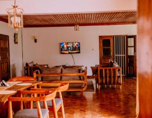 a living room with a couch and a table at Avana Home in Arusha