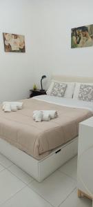a bed with two pillows on it in a bedroom at Sun Terrace Sorrento in Sorrento