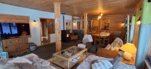 a living room with a couch and a table at Les Grosses Pierres à Spa in Spa