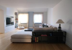a living room with a couch and a table at La Perla di Boccadasse in Genoa
