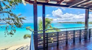 a view of the beach from a house balcony at Holiblue in Blue Bay