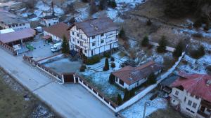 an aerial view of a house with a train station at TRIIBRIA Guest house in Trigrad
