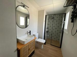 a bathroom with a sink and a shower at Entre Murallas in Doña Mencía +13 photos