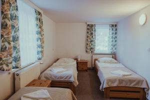 a room with two beds and two windows at Anna in Miłków +36 photos