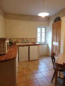 a kitchen with a sink and a counter top at Studio, chambre d'hôtes dans mas provençal in Sauzet