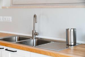 a stainless steel sink in a kitchen at Moderno Mediterraneo in Alberobello +84 photos