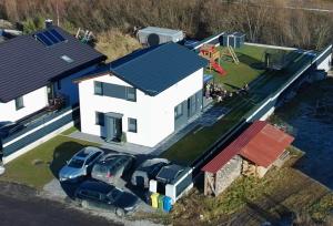 an aerial view of a house with cars parked in front at Chata-Elko Habovka in Habovka