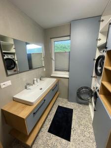 a bathroom with a sink and a mirror at Chata-Elko Habovka in Habovka