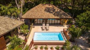 an aerial view of a house with a swimming pool at Koh Jum Beach Villas "A member of Secret Retreats" in Ko Jum