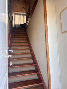 a staircase in a room with a stair case at Tu Espacio en Rada in Rada Tilly