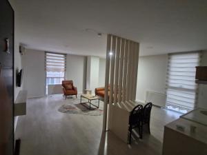 a living room with two chairs and a couch at Suiton6 apart otel in İhsaniye