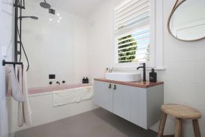 a bathroom with a sink and a tub at The Gums, Beechworth in Beechworth +13 photos