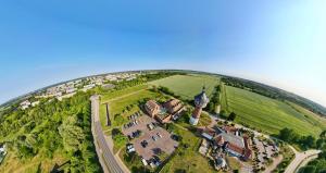 an aerial view of a house on a hill at Turmhotel Schwedt in Schwedt