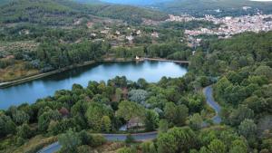 an aerial view of a lake in a city at El Castaño in Guisando