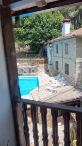 a view of a swimming pool from a balcony at El Castaño in Guisando