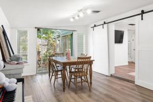 a dining room with a table and chairs at House - Minutes from Siesta Key! in Sarasota