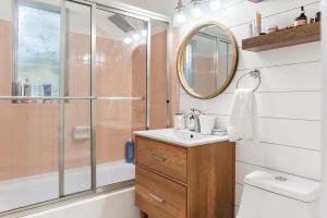 a bathroom with a sink and a shower at House - Minutes from Siesta Key! in Sarasota +21 photos