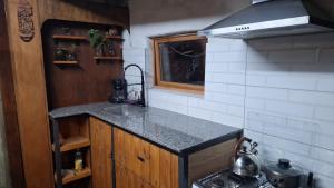a kitchen with a sink and a counter top at Casa ecologica artesanal in Santa Ana