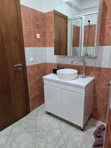 a bathroom with a white sink and a mirror at Golden Flow in Espargos +38 photos