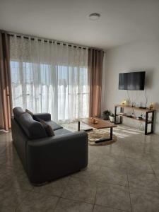 a living room with a couch and a table at Golden Flow in Espargos