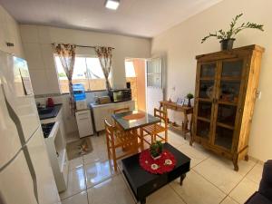 an aerial view of a kitchen and dining room at Casa Becker in Laranjeiras do Sul
