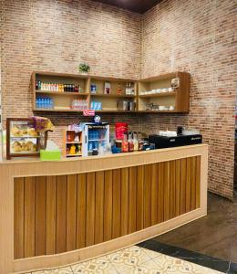 a counter in a grocery store with a counter sidx sidx sidx at Cozy Homes BnB in Prampuan