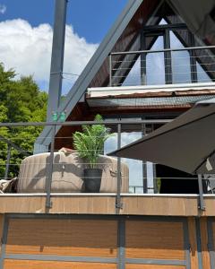 a potted plant sitting on the balcony of a house at Villa Monteverde Goč in Stanišinci