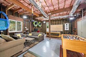 a living room with a pool table and ping pong ball at Moondance in Monte Rio