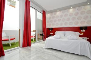 Ein Bett oder Betten in einem Zimmer der Unterkunft The Zentral Arenal Suites