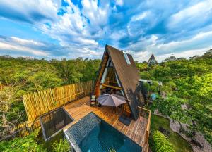 an overhead view of a tiny house with a pool at Zamaya Bangalôs in Sao Jorge